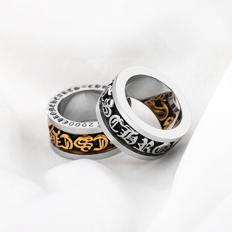 chrome hearts black and gold rotating letter cross flower ring
