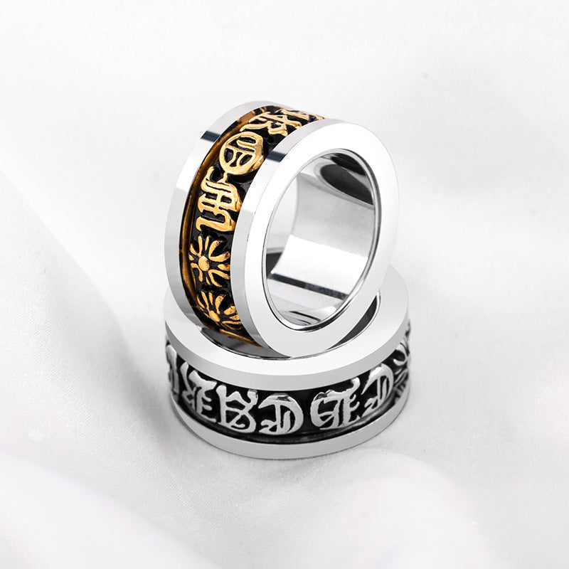 chrome hearts black and gold rotating letter cross flower ring